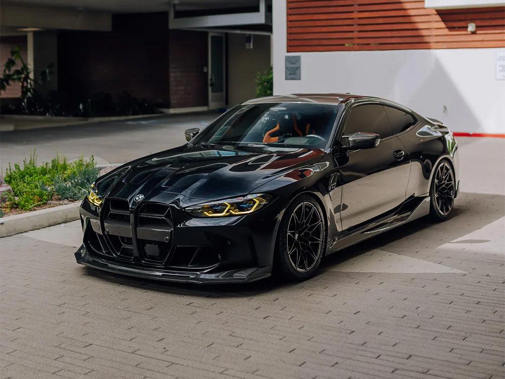 BMW G82 M4 with a carbon fibre kit and yellow DRLs