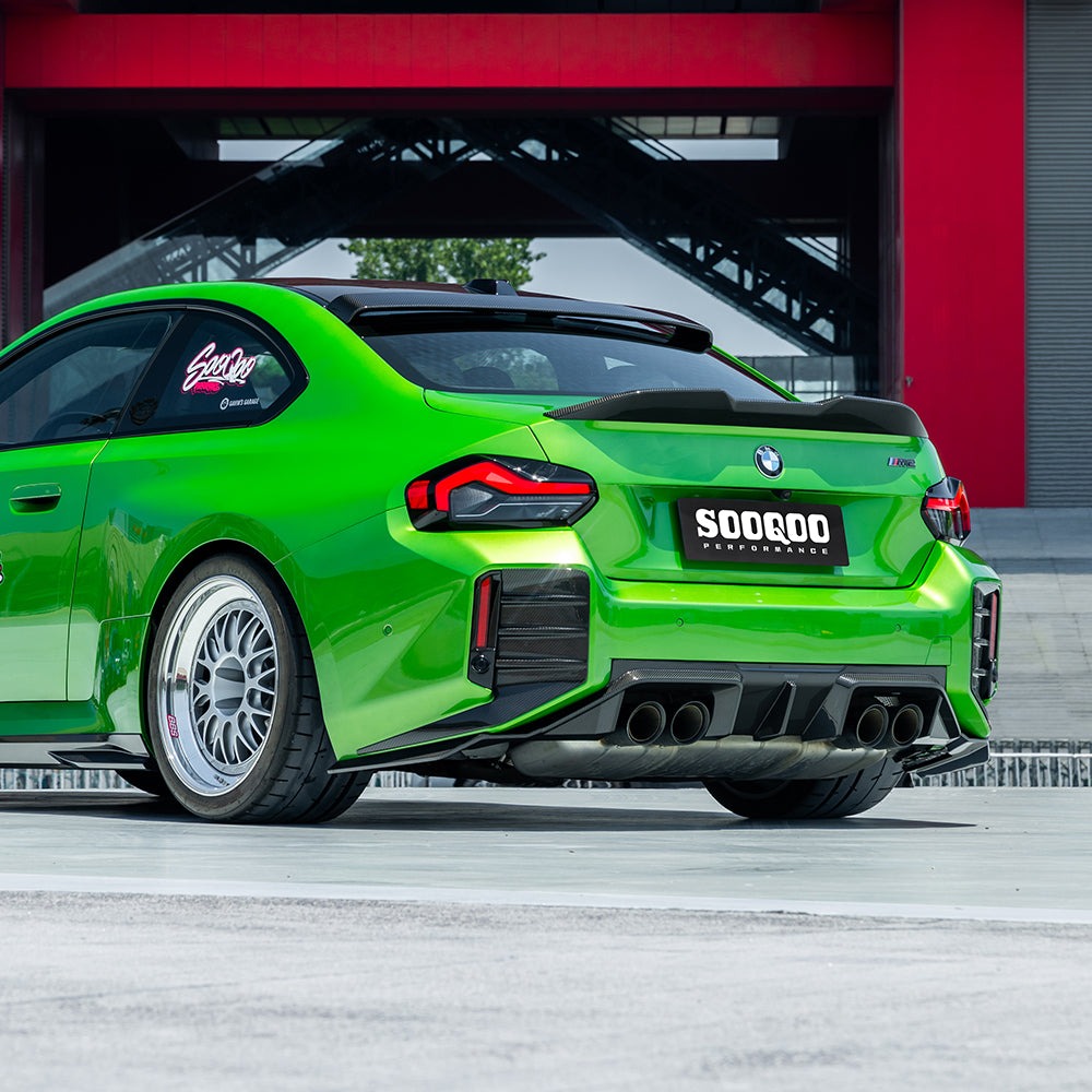 SOOQOO carbon fibre Rear Diffuser V2 on BMW M2 (G87), rear three-quarter wide view on green car