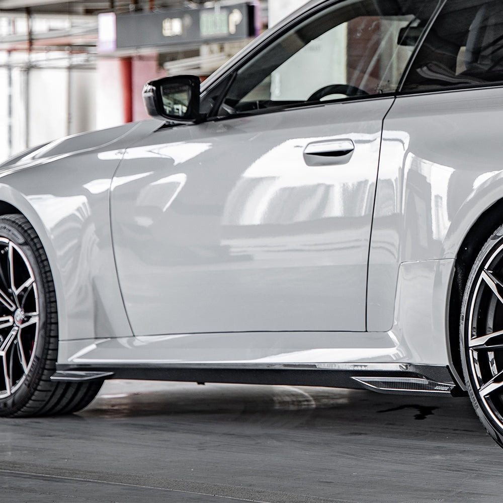 SOOQOO carbon fibre side skirts on BMW M2 (G87), side profile outdoor view