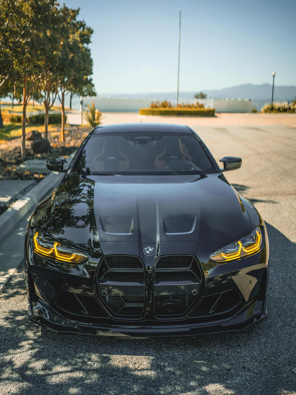 BMW G82 M4 with carbon fibre kit and yellow DRLs