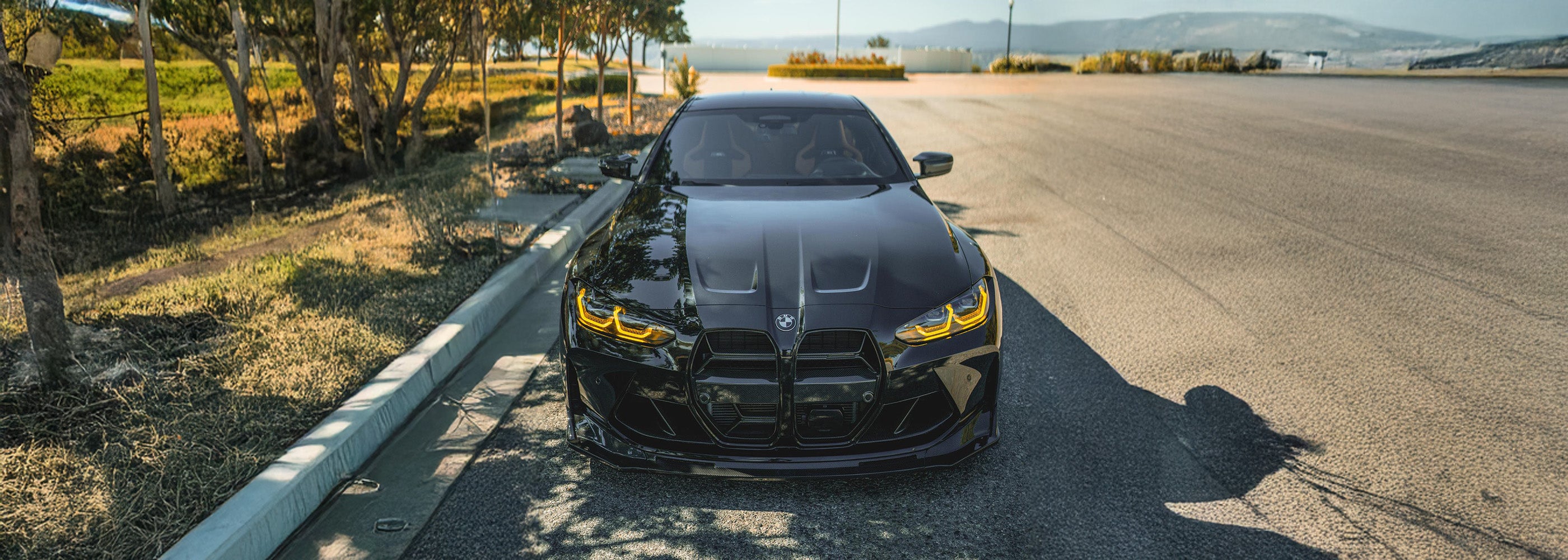 BMW G82 M4 with carbon fibre kit and yellow DRLs