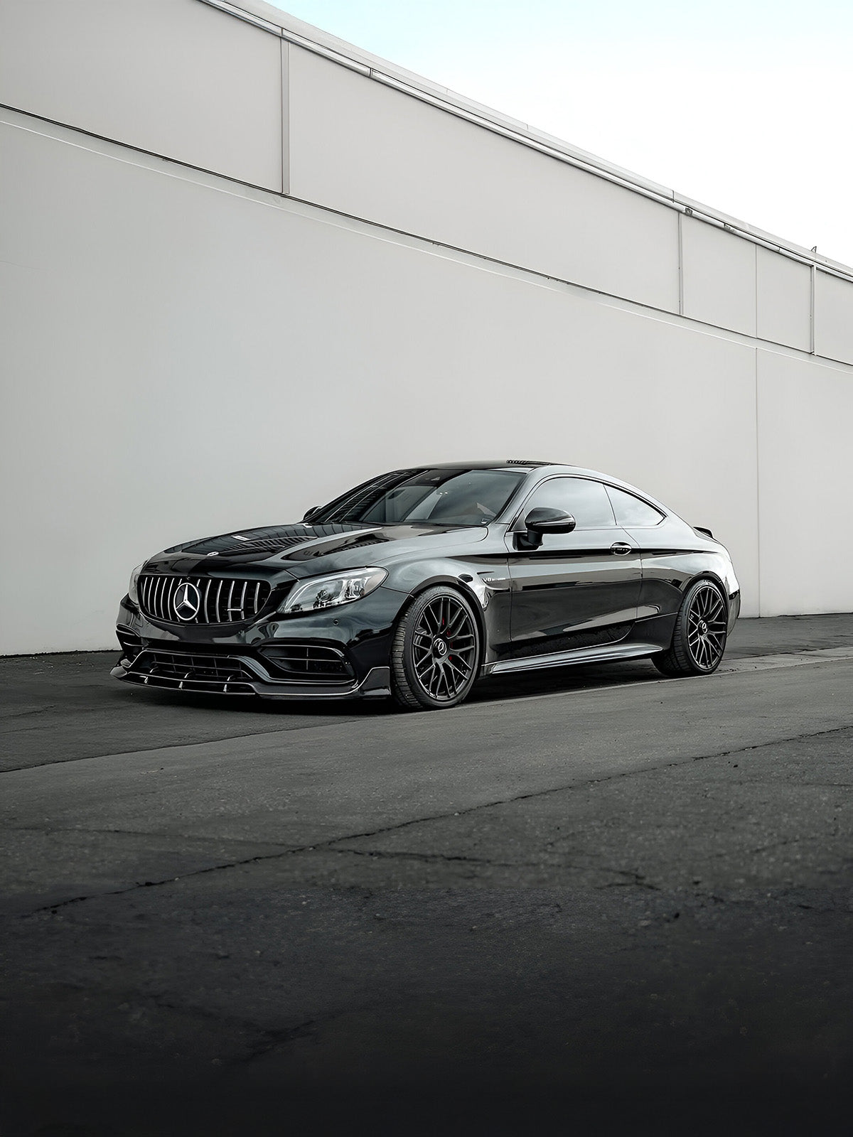 Mercedes C63 Coupe with Carbon Noire carbon fibre front splitter, side skirts, and rear spoiler, styled for a clean and aggressive look