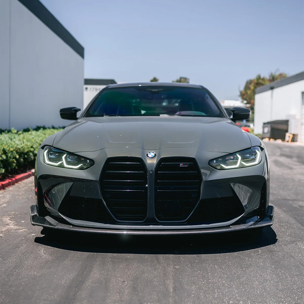 BMW M3 & M4 (G80/G82/G83) with carbon fibre front splitter, side skirts, and rear diffuser