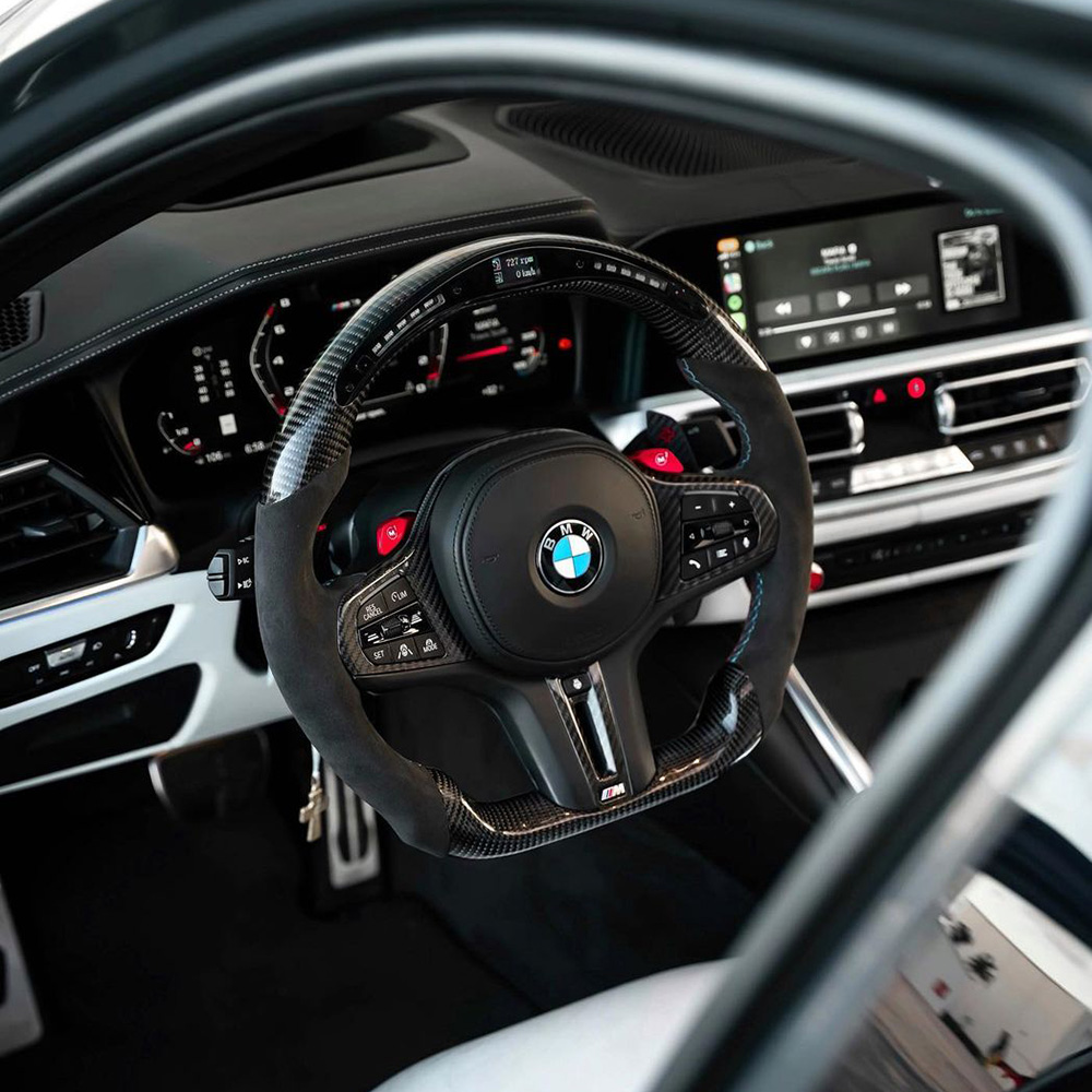 Customisable BMW carbon fibre steering wheels with LED shift lights, alcantara, and carbon paddles
