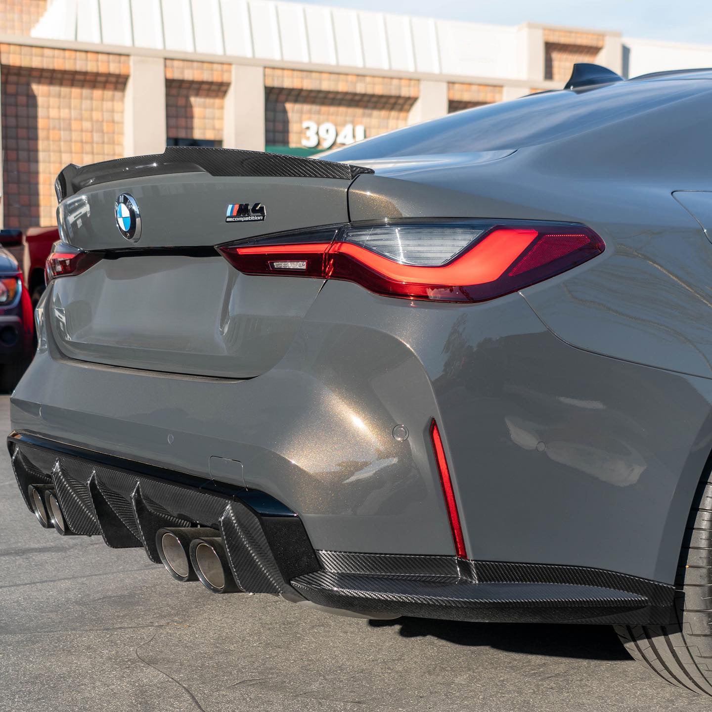 BMW M4 G82 with Carbon Fibre 'M4 Style' Rear Spoiler Installed - Side View