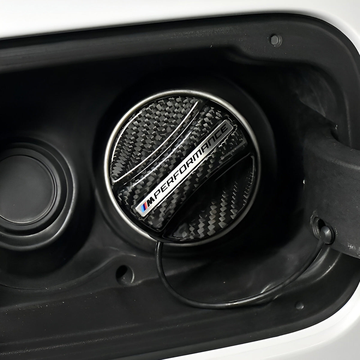 Carbon fibre fuel cap cover installed on BMW – fuel door open