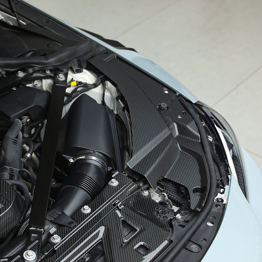 SOOQOO carbon fibre engine bay trim installed on BMW M2 (G87), top front engine bay view