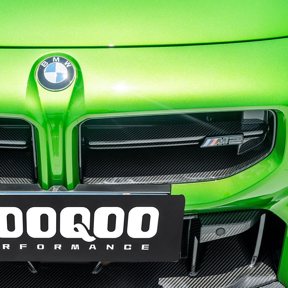 SOOQOO carbon fibre Front Grille V3 installed on BMW M2 (G87), front angle view on green car