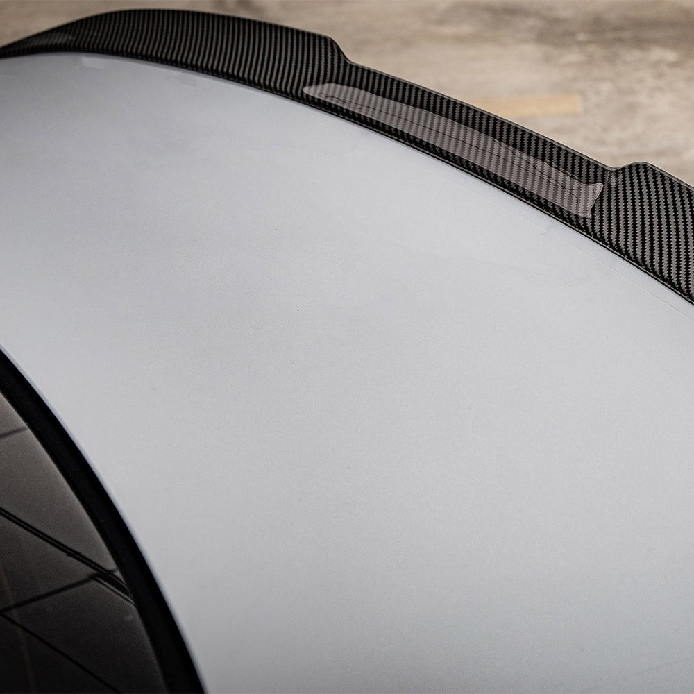 SOOQOO carbon fibre rear spoiler on BMW M2 (G87), side close-up detail