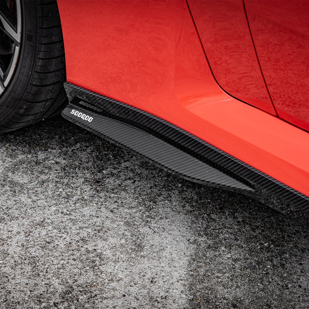 SOOQOO carbon fibre side skirts installed on BMW M2 (G87), sill close-up on orange car